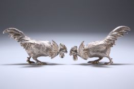 A PAIR OF LATE VICTORIAN SILVER COCKEREL-FORM PEPPERETTES, LONDON 1883