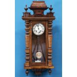 A 19TH CENTURY WALNUT VIENNA PATTERN WALL CLOCK