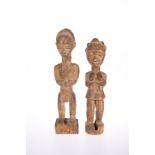 TRIBAL: A PAIR OF CARVED WOODEN FIGURES