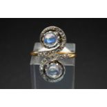 A MOONSTONE AND DIAMOND SET RING