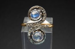 A MOONSTONE AND DIAMOND SET RING