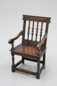 A VICTORIAN CARVED OAK CHAIR, IN 17TH CENTURY STYLE