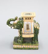 A POLYCHROME GLAZED ELEPHANT-FORM GARDEN SEAT