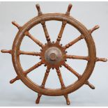 A LARGE HARDWOOD SHIP'S WHEEL OF OVER 5-FOOT DIAMETER