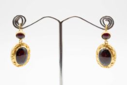 A PAIR OF GARNET SET EARRINGS