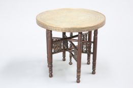 A MOORISH BRASS-TOPPED OCCASIONAL TABLE, EARLY 20TH CENTURY