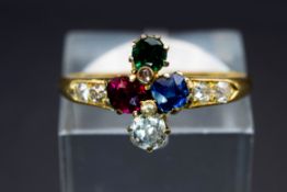 AN 18CT YELLOW GOLD AND GEM SET RING