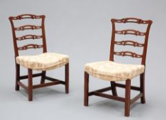 A PAIR OF CHIPPENDALE STYLE LADDER-BACK SIDE CHAIRS