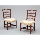 A PAIR OF CHIPPENDALE STYLE LADDER-BACK SIDE CHAIRS