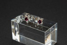 A PAIR OF RUBY AND DIAMOND EARRINGS BY MAPPIN AND WEBB