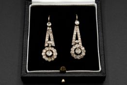 A PAIR OF DIAMOND SET EARRINGS