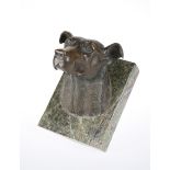 A BRONZE MODEL OF A HOUND'S HEAD MOUNTED ON MARBLE