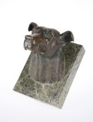 A BRONZE MODEL OF A HOUND'S HEAD MOUNTED ON MARBLE