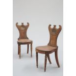 A PAIR OF REGENCY MAHOGANY HALL CHAIRS