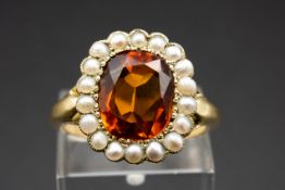 A CITRINE AND SEED PEARL RING