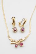 A RUBY AND DIAMOND PENDANT AND EARRING SET