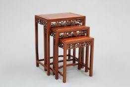 A NEST OF THREE CHINESE HARDWOOD TABLES
