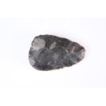 A FLINT AXE HEAD. 11.5cm by 7.5cm