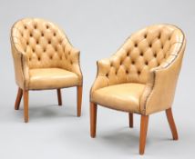 A HANDSOME PAIR OF BUTTON-BACK LEATHER LIBRARY CHAIRS