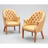 A HANDSOME PAIR OF BUTTON-BACK LEATHER LIBRARY CHAIRS