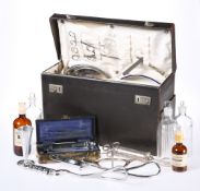 A 1950'S MEDICAL CASE, including an array of instruments and bottles.