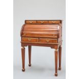 A GILT-HIGHLIGHTED TEAK BUREAU ON STAND