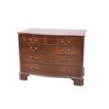 A GEORGE III STYLE MAHOGANY SERPENTINE CHEST OF DRAWERS