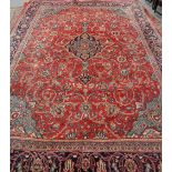 A LARGE MAHAL CARPET, with a central blue medallion against a red ground