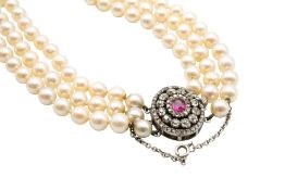 A TRIPLE STRAND CULTURED PEARL NECKLACE WITH A 19TH CENTURY RUBY AND DIAMOND CLASP