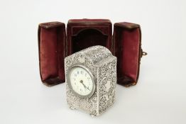 A LATE VICTORIAN SILVER-CASED MINIATURE TRAVELLING CLOCK, DOUGLAS CLOCK CO., BIRMINGHAM 1896