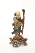 A CHINESE PARCEL-GILT AND POLYCHROME PAINTED CARVED WOODEN FIGURE OF AN IMMORTAL