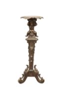 A 19TH CENTURY CARVED PINE TORCHERE