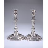 A PAIR OF SWISS CAST SILVER CANDLESTICKS, VEVEY, CIRCA 1780-1800