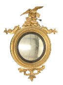 A REGENCY GILT GESSO CONVEX MIRROR