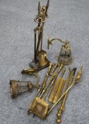 A COLLECTION OF 19TH CENTURY AND LATER BRASS FIRE TOOLS