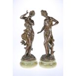 AFTER CHARLES LEVY, A PAIR OF PATINATED BRONZE FIGURES OF MAIDENS