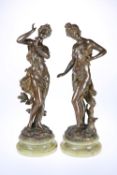 AFTER CHARLES LEVY, A PAIR OF PATINATED BRONZE FIGURES OF MAIDENS