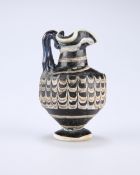 A RARE GREEK CORE-FORMED GLASS OINOCHOE, CIRCA 1ST-4TH CENTURY BC