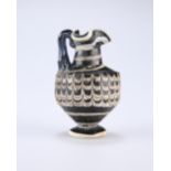 A RARE GREEK CORE-FORMED GLASS OINOCHOE, CIRCA 1ST-4TH CENTURY BC