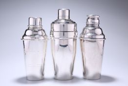 THREE SILVER-PLATED COCKTAIL SHAKERS