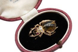 A LATE 19TH CENTURY CAT'S EYE CHRYSOBERYL, RUBY AND DIAMOND BEETLE BROOCH