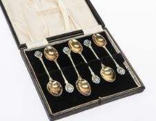 A BOXED SET OF SIX GEORGE V SILVER AND ENAMEL SPOONS