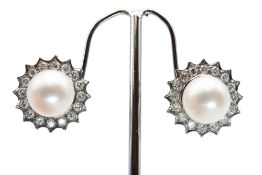 A PAIR OF CULTURED PEARL AND DIAMOND CLUSTER EARRINGS