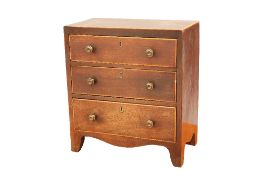 AN EARLY 19TH CENTURY MAHOGANY MINIATURE CHEST OF DRAWERS