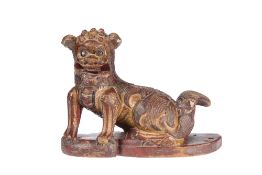 A CHINESE CARVED WOODEN MODEL OF A FOO DOG