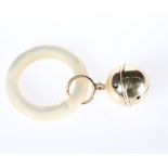 A GOLD BABY'S RATTLE, the bell loop stamped 14K
