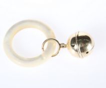 A GOLD BABY'S RATTLE, the bell loop stamped 14K