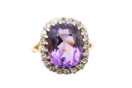 AN AMETHYST AND DIAMOND CLUSTER RING