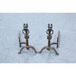 A PAIR OF WROUGHT IRON FIRE DOGS