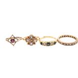 A collection of four yellow gold and gem set rings